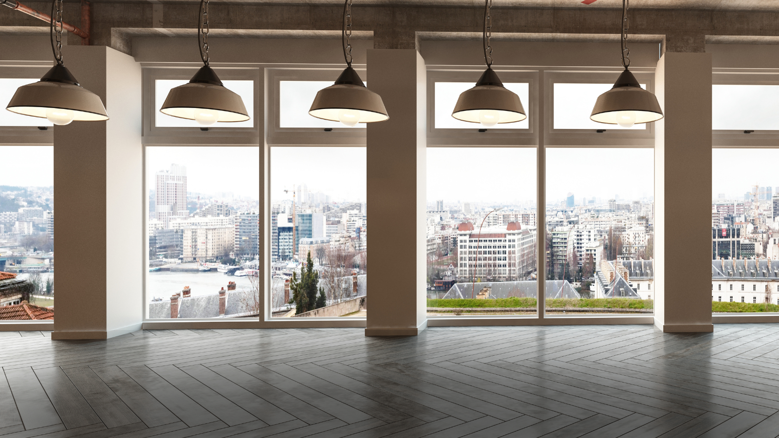 Empty office room with a large window and a view of a city.