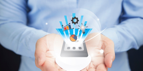 Hands holding a mobile phone. From the mobile phone there are a number of icons projected including a settings icon, pie chart and light bulb.