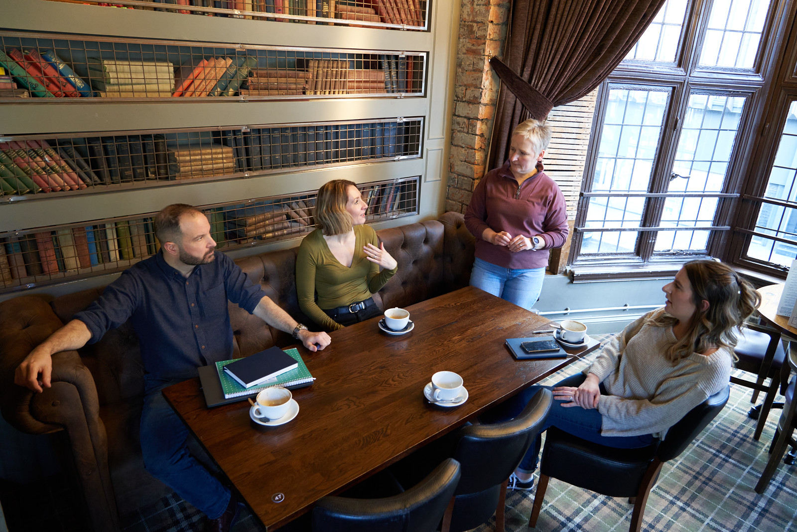 Cal partners team in conversation, sitting on a sofa. Pictured left to right: Chris Lucarelli, Rachel Wright, Alison O'Neill and Marianne Carey.