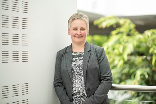 Picture of our Account Manager, Alison O'Neill wearing a grey suit. The photo is in the style of a professional headshot.