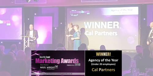 A banner saying 'Northern Marketing Awards'. In the background Cal Partner Director, Chris Lucarelli holds an award on stage.