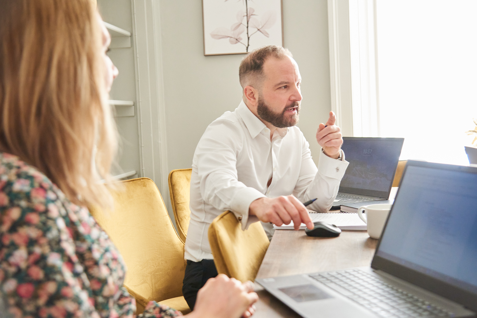 Strategic marketing: Chris Lucarelli sitting at a table in conversation.
